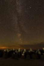 Northern Lights with Milky Way at the North Sea, Hörnum, Sylt, Tetrapode (stone),