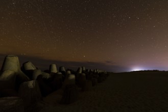 Northern Lights with Milky Way at the North Sea, Hörnum, Sylt, Tetrapode (stone),