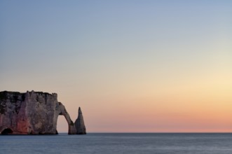 Rock arch Falaise or Porte d'Aval and rock needle Aiguille, illuminated, illuminated, Étretat, sea,