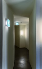 Emergency exit, narrow corridor in a public building, Berlin, Germany
