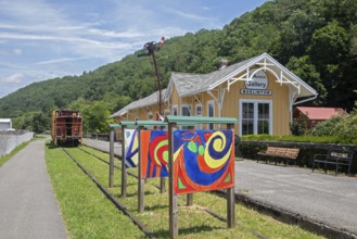 Marlinton, West Virginia - The Greenbrier River Trail runs past a restored train station which is