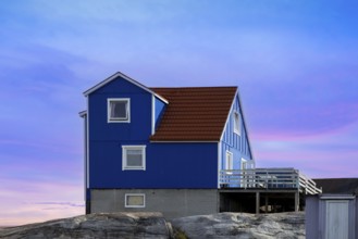 Typical architecture of Greenland Ilulissat with colored houses located near fjords and icebergs