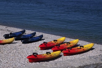 Kayaks, boats, colourful, lying on the beach, pebble beach, Étretat, sea, Normandy, Seine-Maritime,