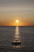 Children playing on bathing island, bathing raft, swimming island, Étretat, sea, sunset, evening