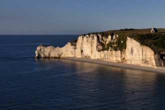 Rock arch Falaise or Porte d'Amont, beach, church Chapelle Notre Dame de la Garde, Étretat, sea,