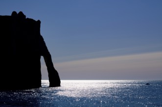 Rock arch Falaise or Porte d'Aval against the light, silhouette, Étretat, sea, cliffs, cliffs,