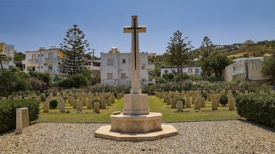 Large cross on a cemetery surrounded by gravestones and trees, Military Cemetery, Commonwealth War