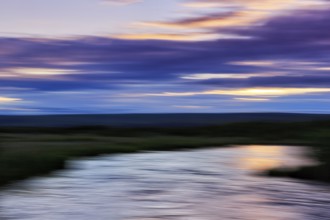 River landscape, evening sky, motion blur, light reflections, text free space, Iceland