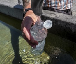 Drinking water supply at a public well, Bavaria, Germany