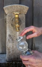 Drinking water supply at a public well, Bavaria, Germany
