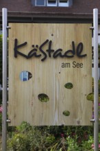 Wooden sign KäStadel am See, Kässtadel, specialist cheese shop with bistro, cheese shop,