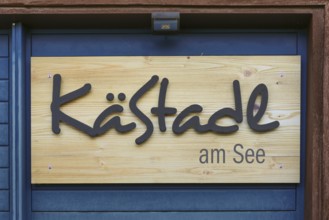 Wooden sign KäStadel am See, Kässtadel, specialist cheese shop with bistro, cheese shop,