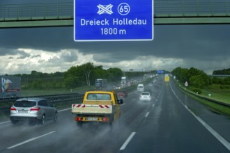 Road traffic during thunderstorm, heavy rain, poor visibility, black sky, aquaplaning, motorway A9