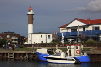 Timmendorf lighthouse on the island of Poel on the Baltic Sea, harbour in the foreground,