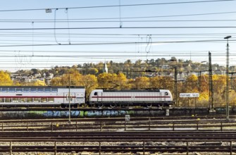 InterCity entering Stuttgart Central Station in autumn. Apron with station sign. Stuttgart,