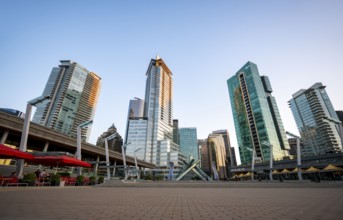 Olympic Cauldron Statue, Jack Poole Plaza Square, skyscrapers on the promenade at sunset, Coal