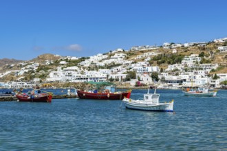Mykonos, Cyclades, Greece - fishing boats are moored in the old port of Mykonos Town, Mykonos Chora