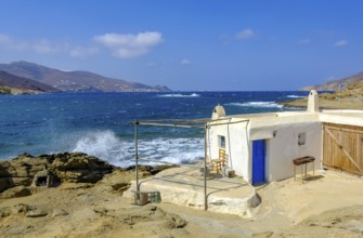Mykonos, Cyclades, Greece - Ftelia Beach, fishing lodge on Ftelia beach, sandy beach on windy rocky