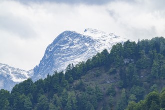 View into the mountains next to Lake Almsee on a rainy day in spring, Traunstein summit,