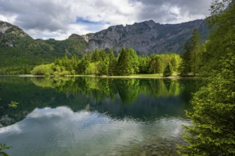 Landscape of Lake Offensee after rain when the sun comes through the clouds in spring,