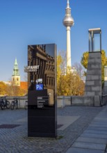 Black information columns with signs and signs on the forecourt of the Humboldt Forum Berlin,