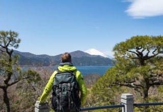 Tourist enjoying the view, Benten-no-hana Tenbodai viewpoint, Hakone Park, view of Lake Ashi with