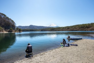 Anglers at Lake Saiko, behind volcano Mt. Fuji, Minamitsuru District, Yamanashi Prefecture, Japan