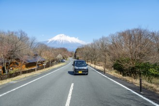 Car on road, road leads to Mount Fuji volcano, wanderlust, Yamanashi Prefecture, Japan