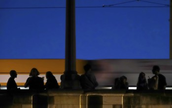 Tourists in Dresden on a bridge in the evening, Saxony, Germany