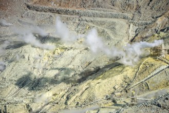 Steaming fumaroles in the Owakudani geothermal area at Komagatake volcano, Hakone, Japan