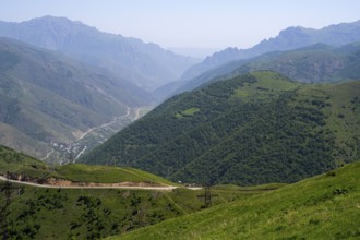 Panoramic view of a valley with road and green hills between mountains, view of Lernadzor