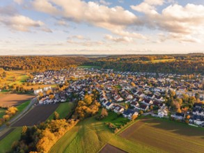 Village nestled in autumnal hills and vegetation, Aidlingen, Böblingen district, Germany