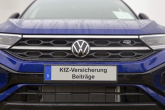 (photo montage) Close-up of a license plate with text Car insurance CONTRIBUTIONS