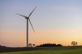 Wind turbine in field at sunset, peaceful landscape, Swabian Jura, Baden-Württemberg, Germany