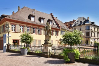 Ettlingen, Germany - August 13th 2025: Statue of Saint John of Nepomuk on Rathausbrücke bridge over
