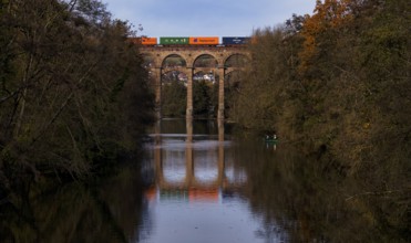 Freight train, container from Hapag-Lloyd, UASC, train stains on railway viaduct, viaduct, railway