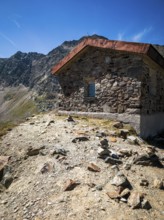 Steinerne Hütte at the Timmelsjoch rest house on the border between Austria and Italy, above