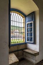 Window inside a Baroque church overlooking the historic city of Ouro Preto in Minas Gerais, Ouro