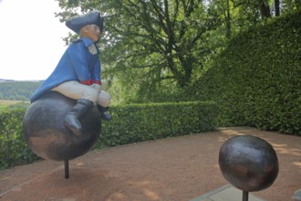 Baron von Münchhausen sculpture in the castle park, lying baron, uniform, blue, white, hat,