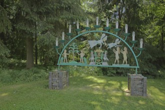 Traditional candle arch with angels and figures, forest, candles, Johanngeorgenstadt, Western Ore