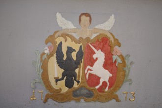 Relief of angel and coat of arms with eagle figure and unicorn, lion fountain built in 1773, year,