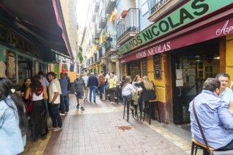 People outside tapas bars in El Tubo area of the Old Town, Zaragoza, Aragon, Spain