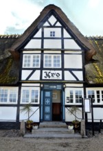 Danish inn, restaurant, in typical half-timbered house with thatched roof on Funen, Fyn island,