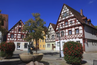 Half-timbered houses and fountains on Rathausplatz, city of Heideck in the district of Roth, Middle