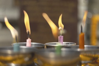 Oil lamps lit by believers as a symbol of the light of wisdom (the light dispels darkness and