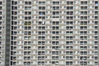 Exterior façade of a residential high-rise building of Condo U (a brand or series name of the Thai
