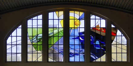 Lead glazing of the windows above the main entrance with the title Four Elements by Horst