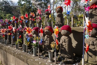 Jizo statues with red crocheted caps, guardian deities for deceased children, Unborn Children