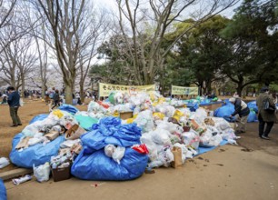 Large piles of trash at a garbage collection point, garbage bags, Yoyogi Park, Hanami Festival,