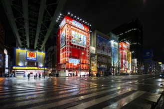 Street with illuminated shops at night in Akihabara, Electric City, Tokyo, Japan